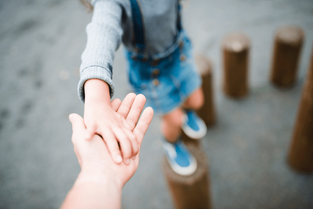 Parenting Mental Health . Parent and child holding hands